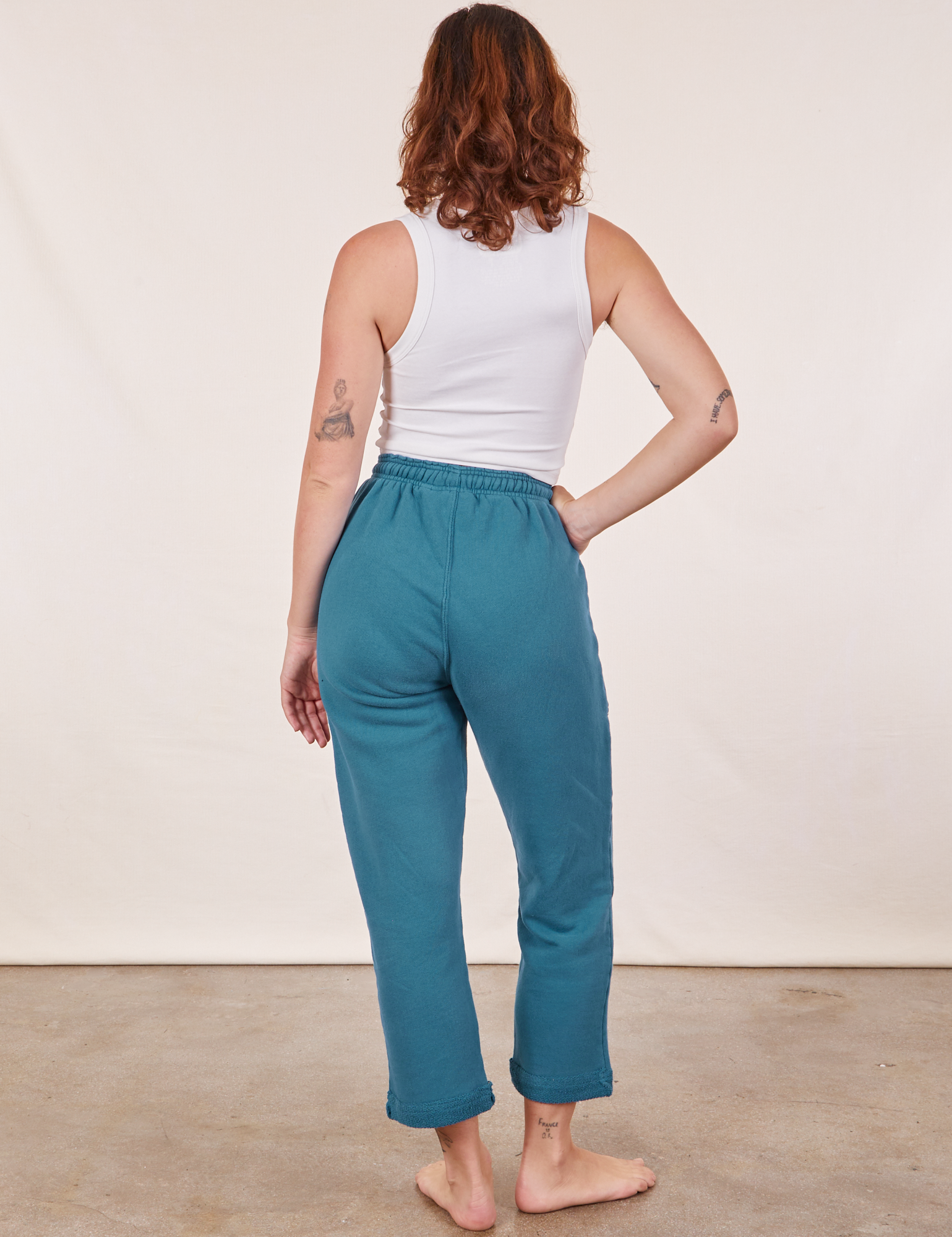 Back view of Cropped Rolled Cuff Sweatpants in Marine Blue on Alex