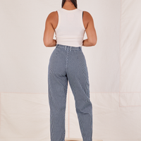 Back view of Denim Trouser Jeans in Railroad Stripe and vintage off-white Tank Top on Gabi