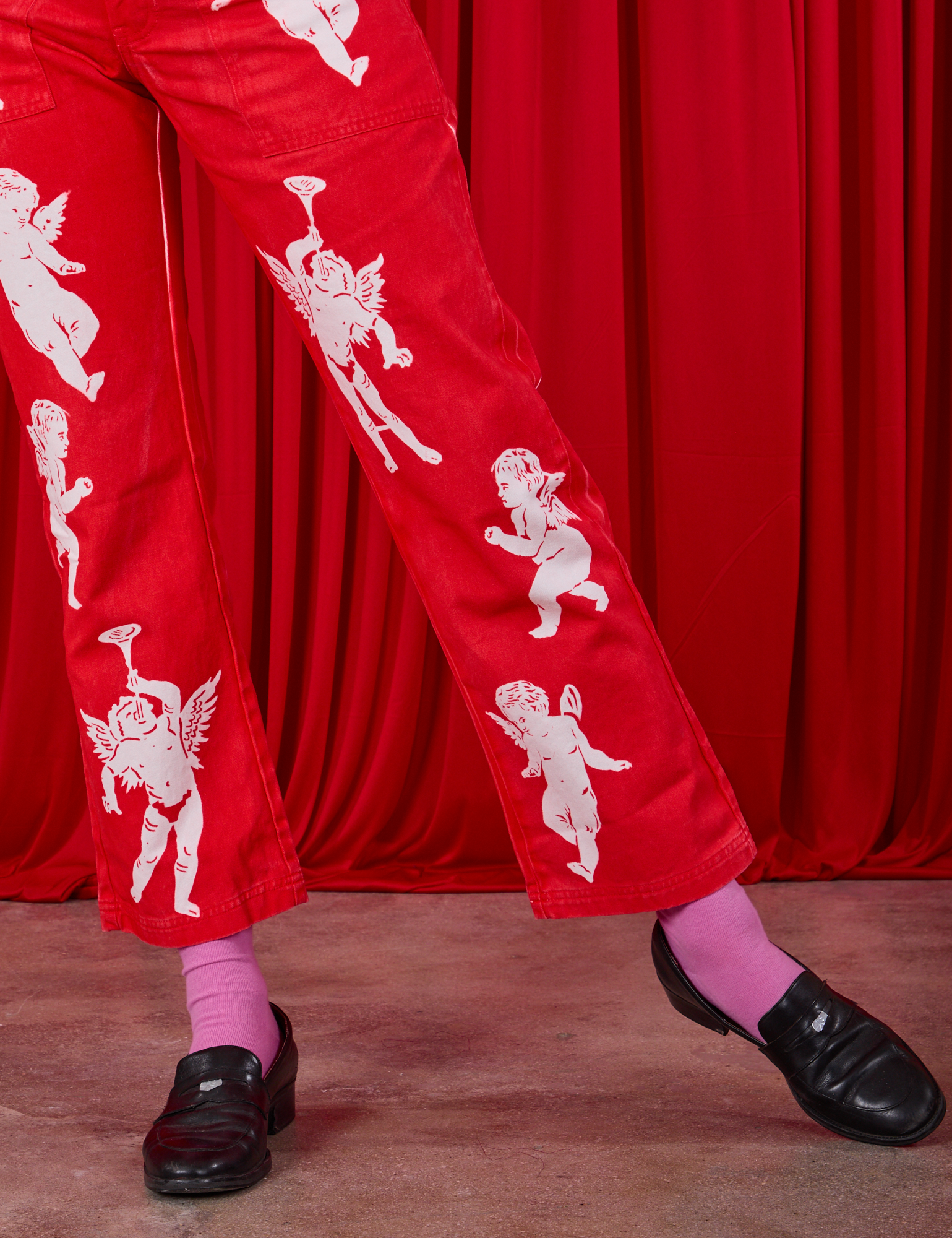 Airbrush Cupid Work Pants pant leg close up on Alex