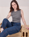 Hana is wearing Muscle Tee in Washed Grey and dark wash Carpenter Jeans