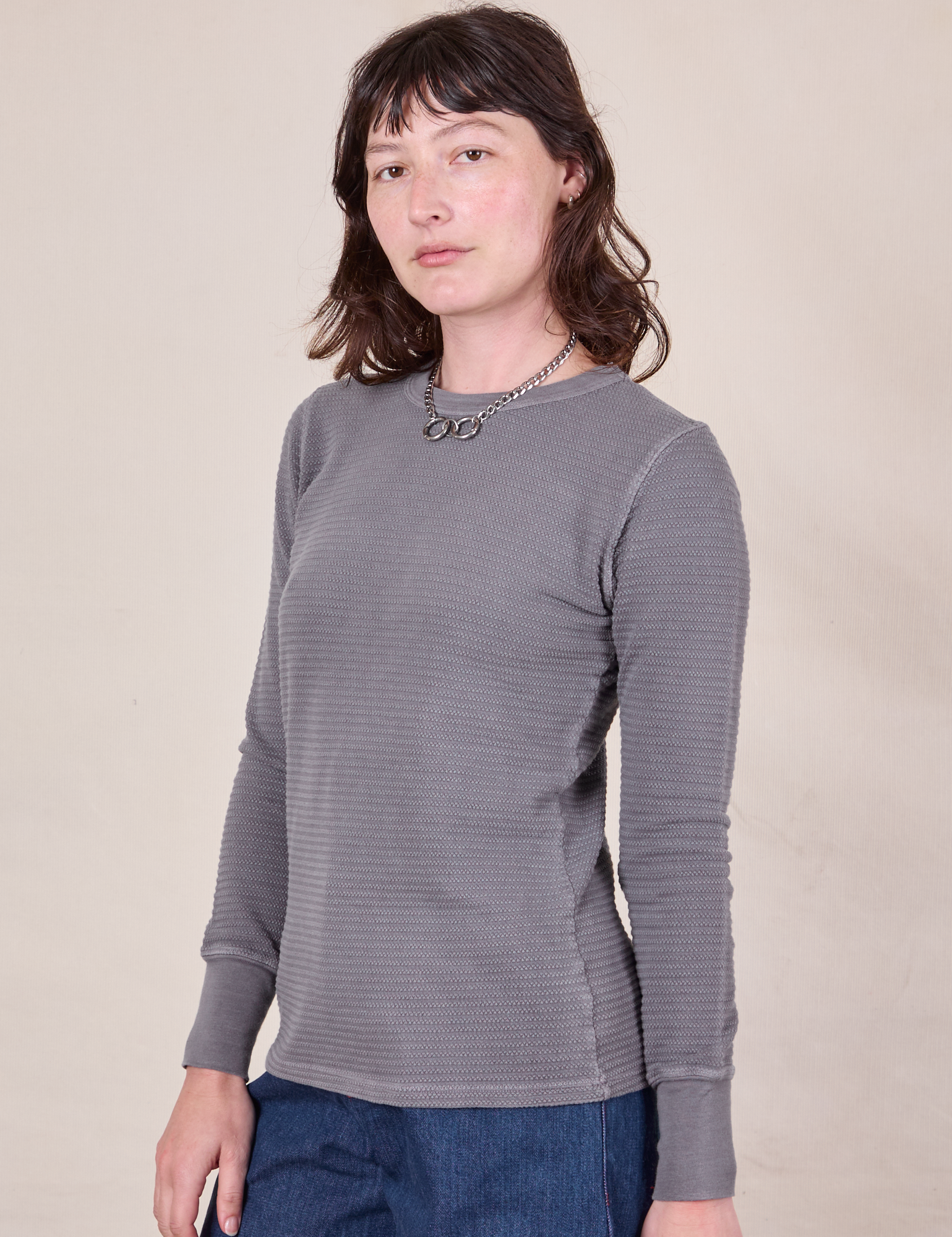 Angled front view of Honeycomb Thermal in Washed Grey on Alex