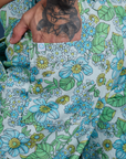 Close up of Jesse's hand in the back pocket of Winter Floral Print Work Pants