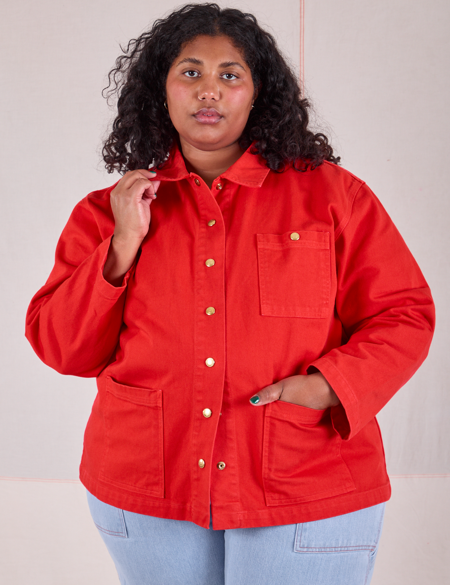 Morgan is wearing a buttoned up Denim Work Jacket in Mustang Red