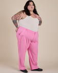 Angled front view of Work Pants in Bubblegum Pink paired with Cropped Tank in Vintage Tee White