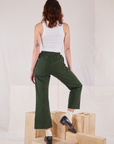 Back view of Action Pants in Swamp Green and Cropped Tank in vintage tee off-white on Alex