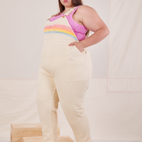 Side view of Rainbow Overalls and bubblegum pink Cropped Tank Top on Marielena