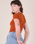 Baby Tee in Burnt Terracotta angled back view on Alex