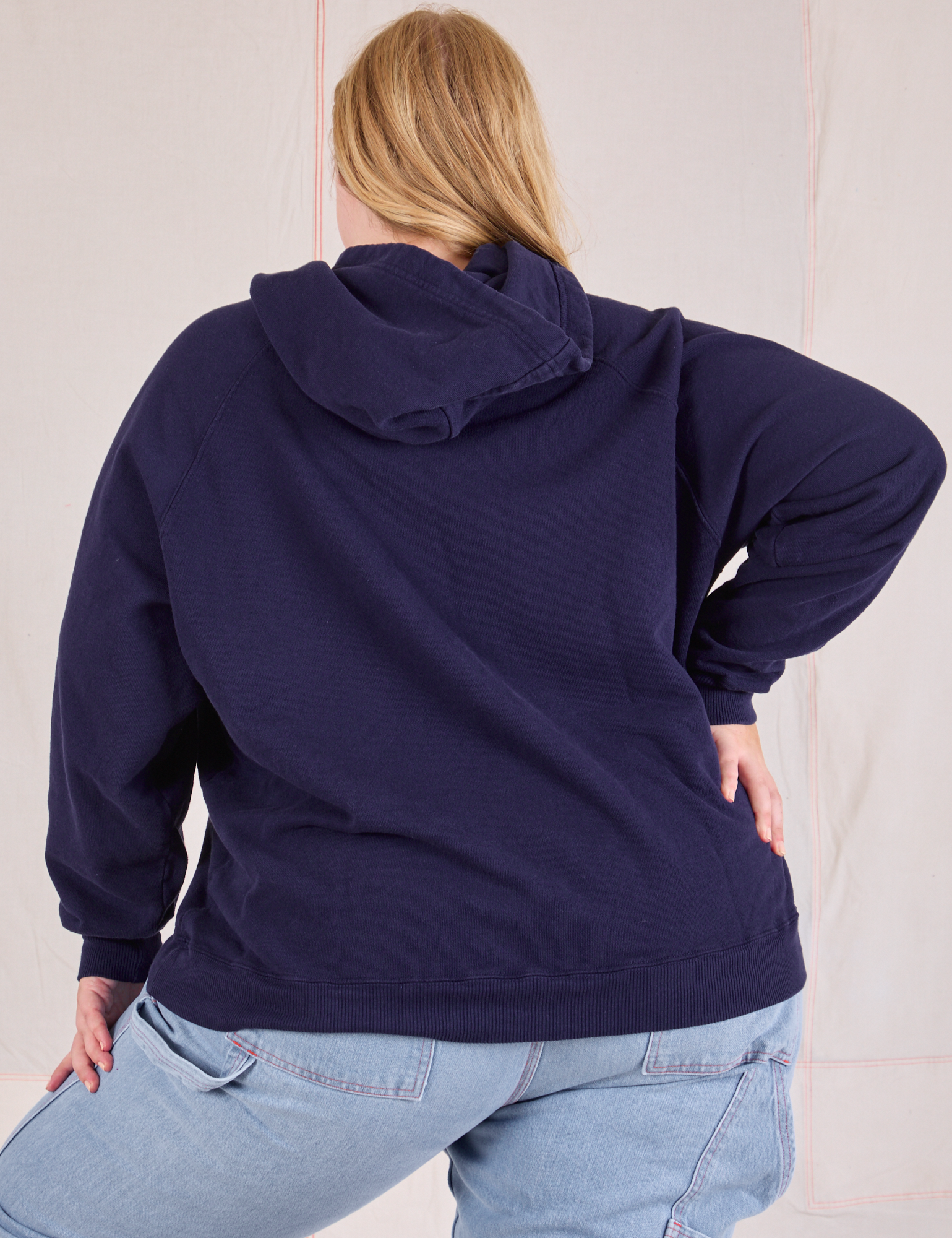 Collegiate Hoodie in Navy Blue back view on Juliet