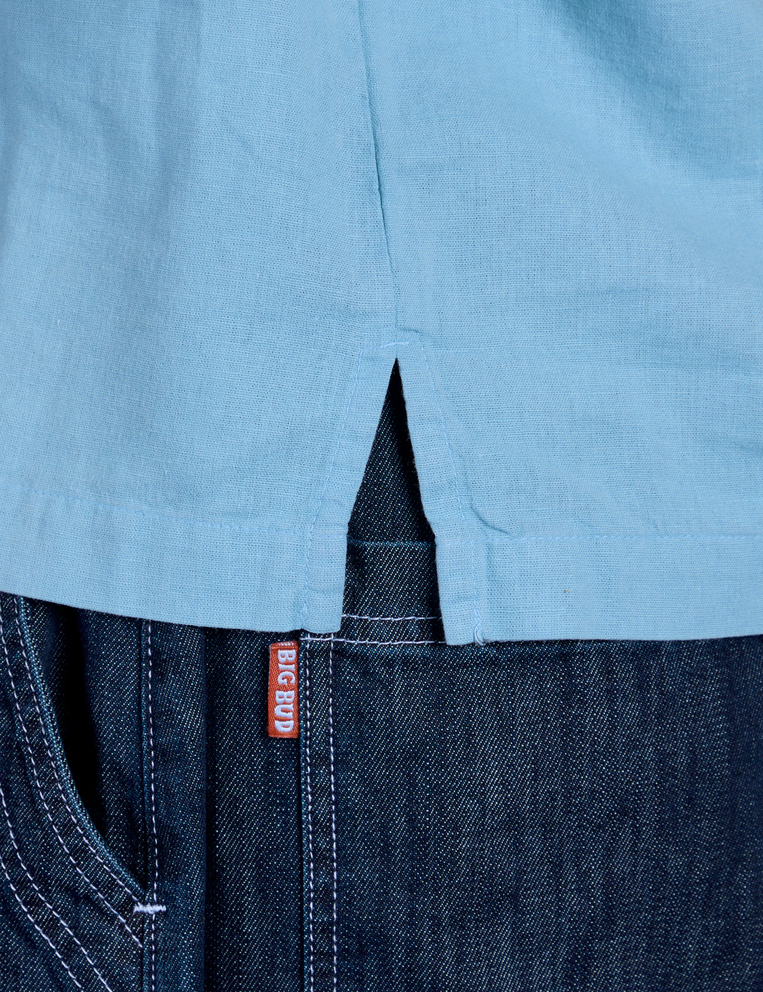 Painted Pantry Button-Up in Baby Blue side vent close up