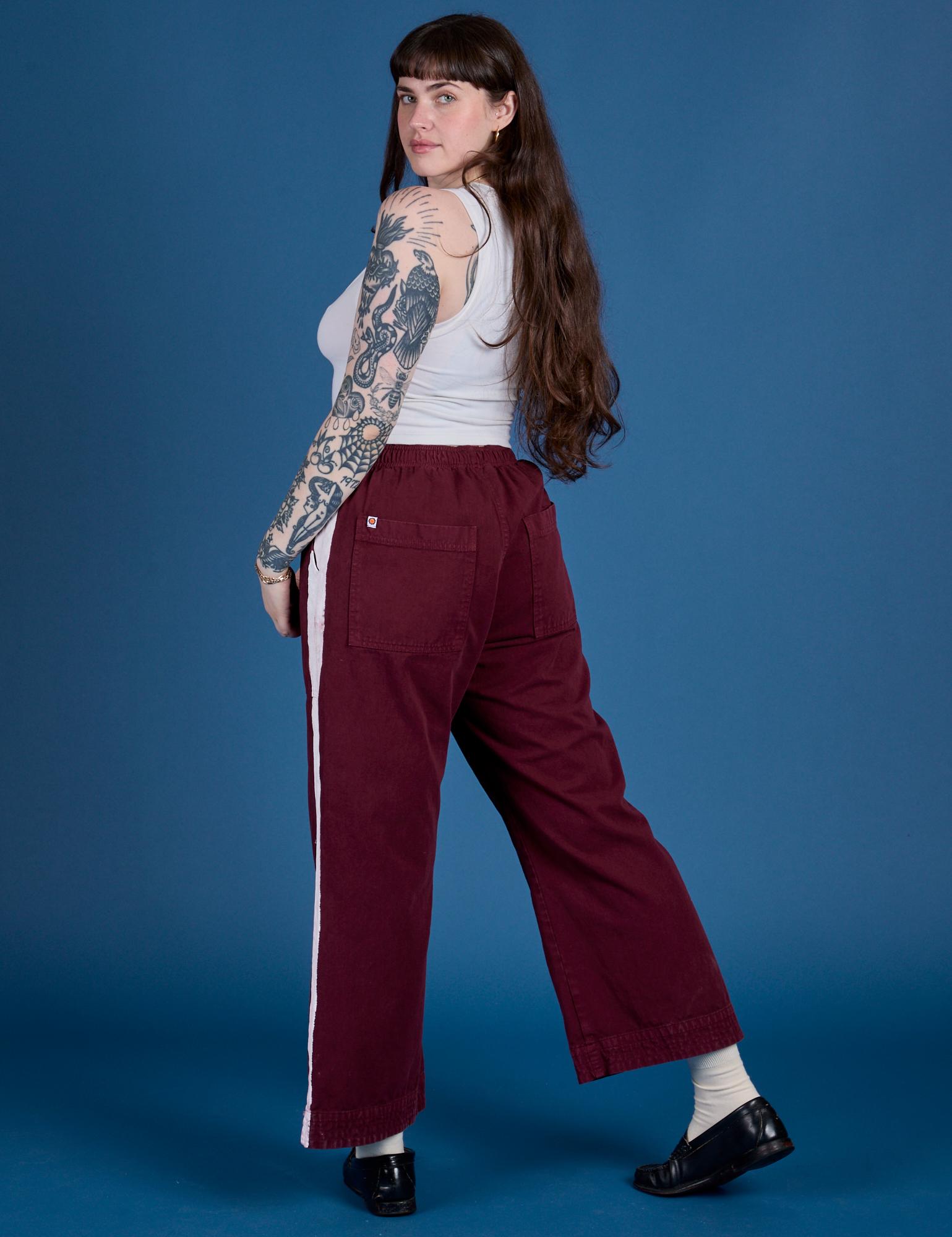 Painted Action Pants in Red Wine angled back view on Sydney