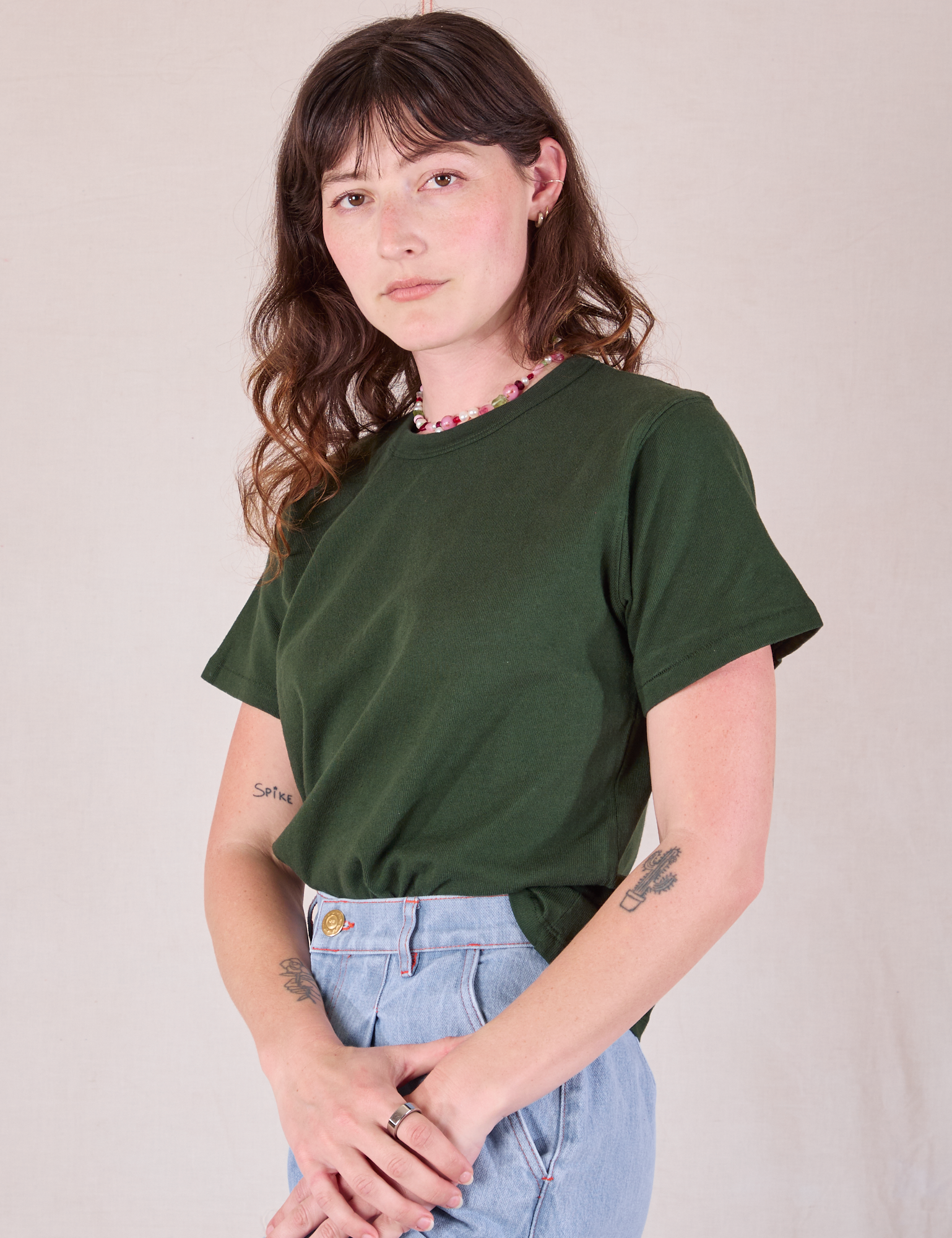 Burly Tee in Swamp Green angled front view on Alex