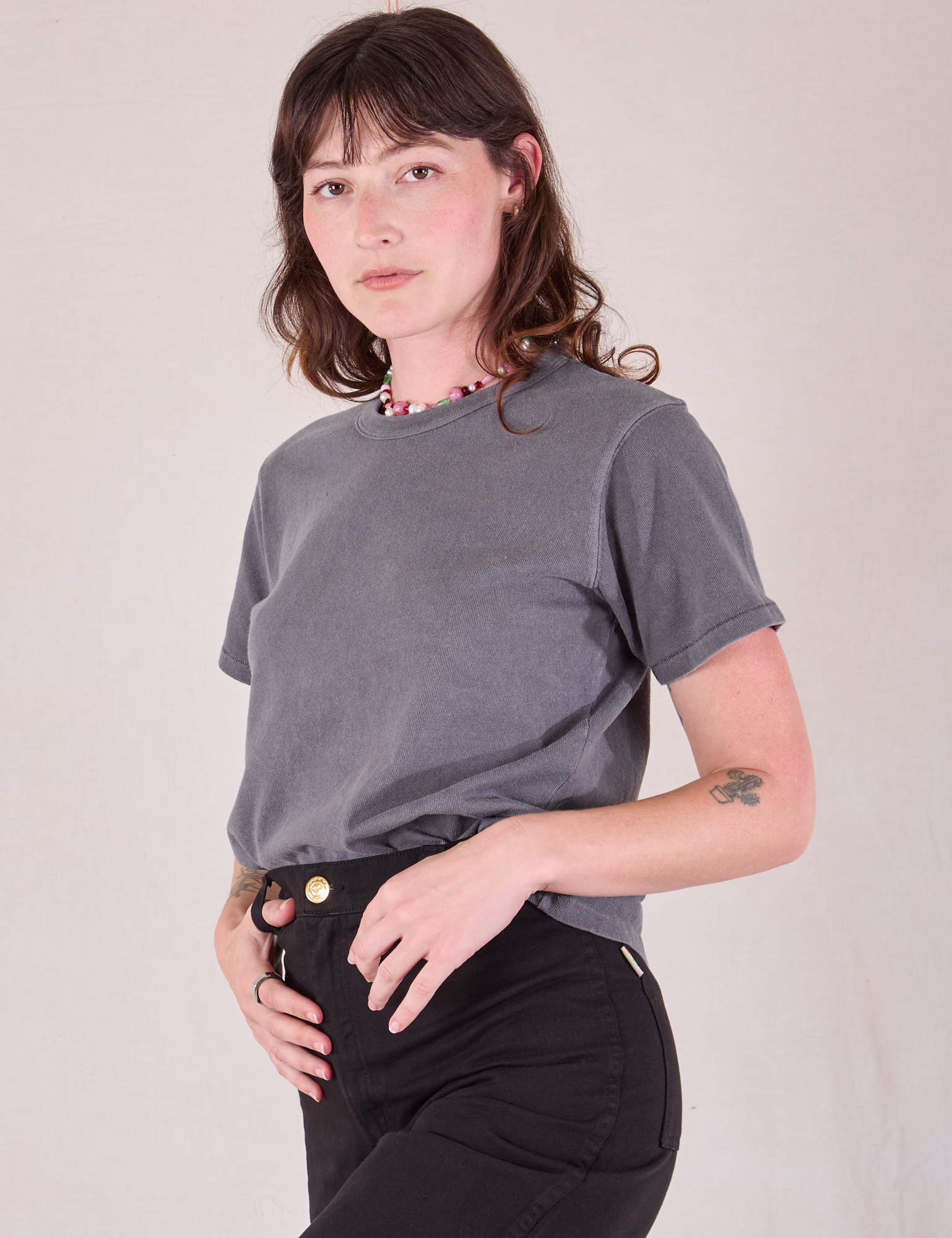 Angled front view of Burly Tee in Washed Grey worn by Alex