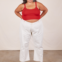 Alicia is wearing Cropped Cami in Mustang Red and vintage off-white Western Pants