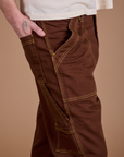 Carpenter Jeans in Fudgesicle Brown side close up on Quinn