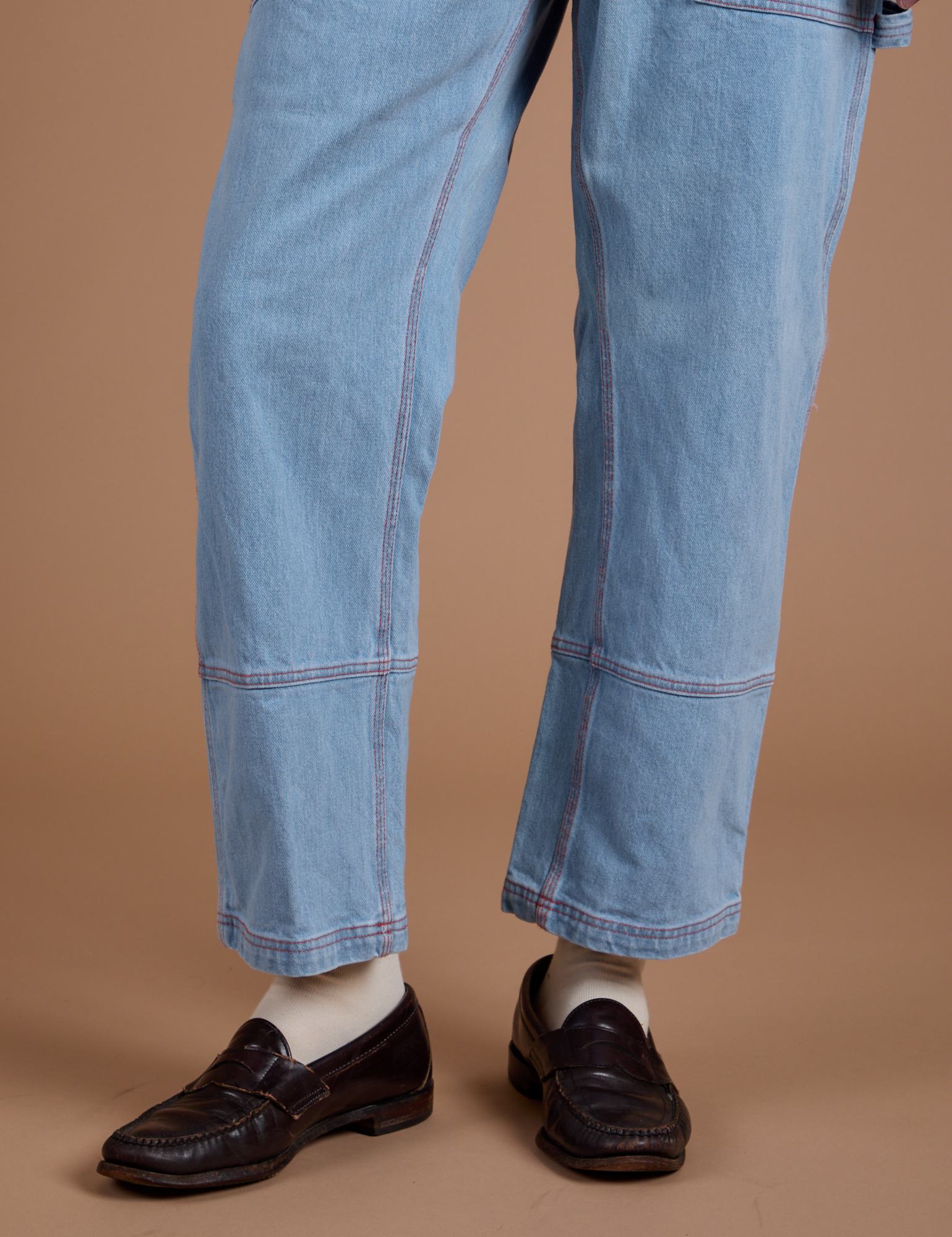 Carpenter Jeans in Light Wash pant leg close up on Quinn