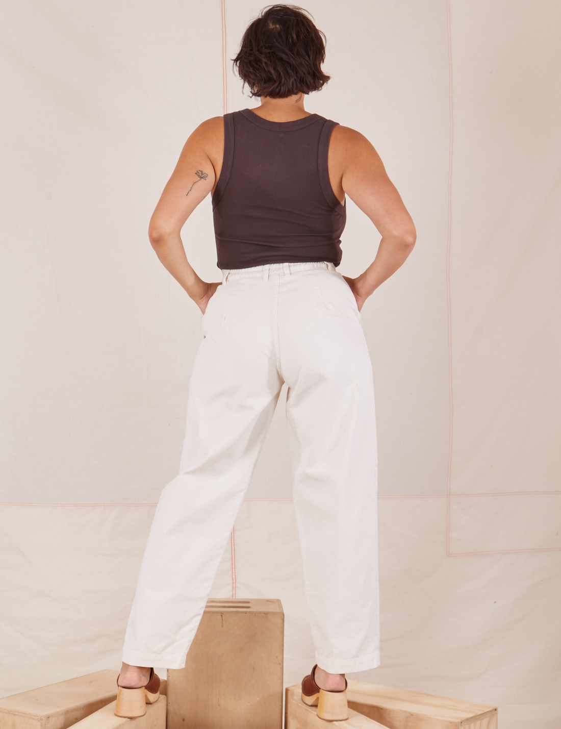 Back view of Heavyweight Trousers in Vintage Off-White and espresso brown Cropped Tank Top worn by Tiara.