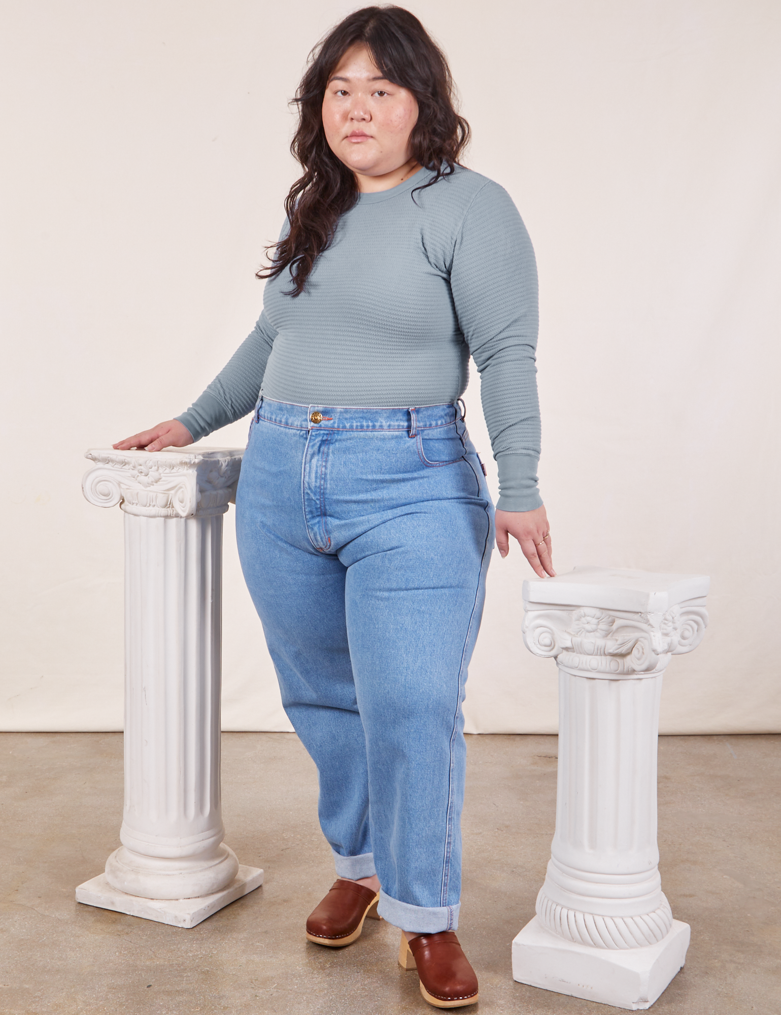 Ashley is wearing Honeycomb Thermal in Periwinkle and light wash Frontier Jeans