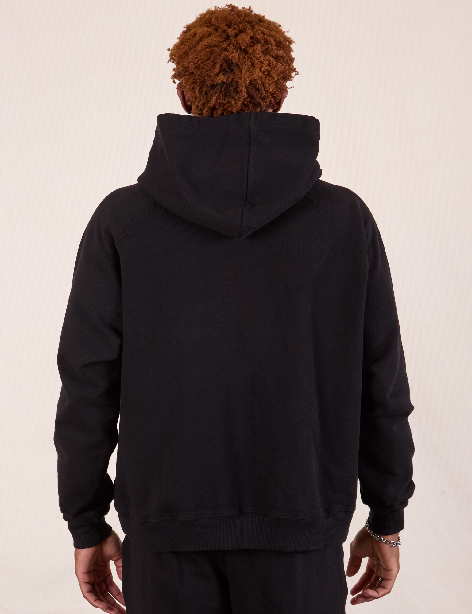 Oversized Hoodie in Basic Black back view on Issac