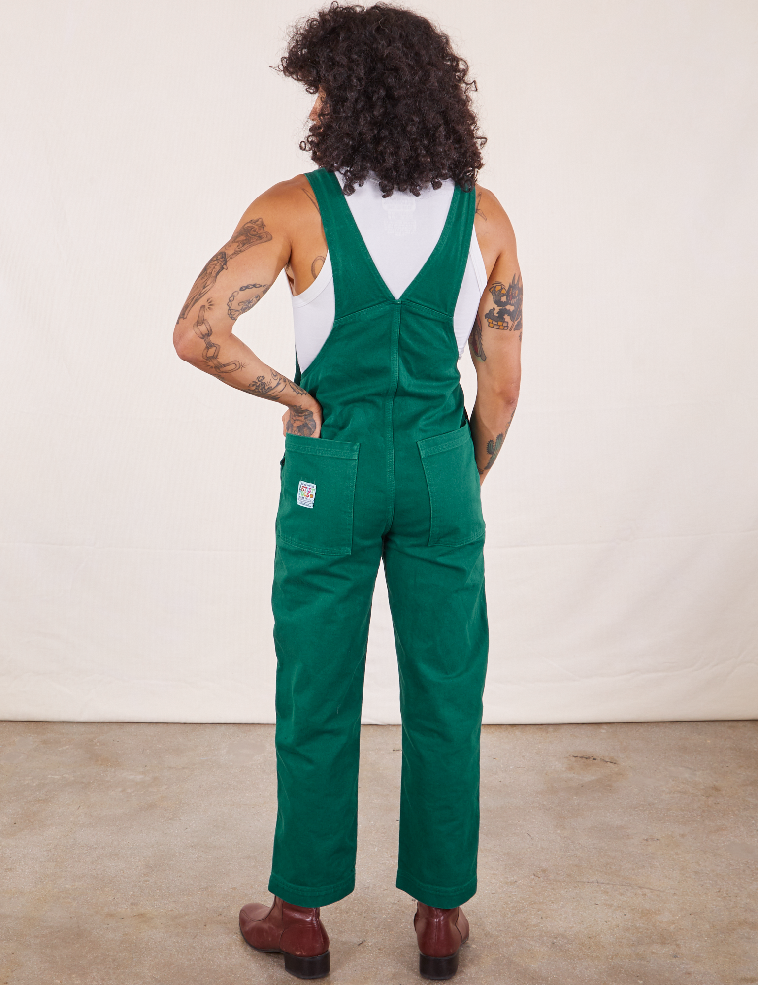 Back view of Original Overalls in Mono Hunter Green worn by Jesse