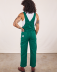 Back view of Original Overalls in Mono Hunter Green worn by Jesse
