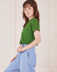 Side view of Organic Vintage Tee in Lawn Green and light wash Trouser Jeans worn by Hana
