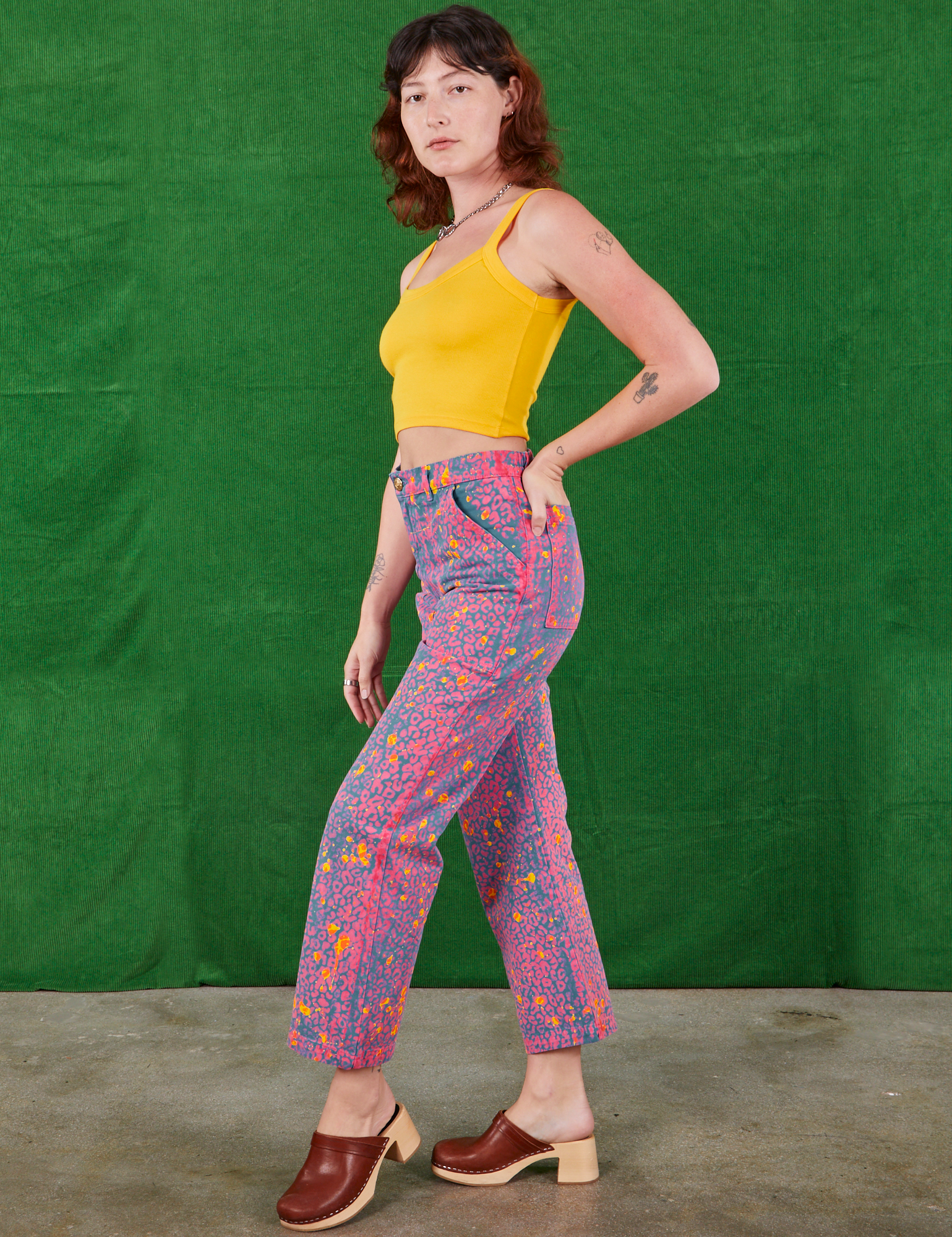 Side view of Work Pants in Electric Leopard and sunshine yellow Cami on Alex