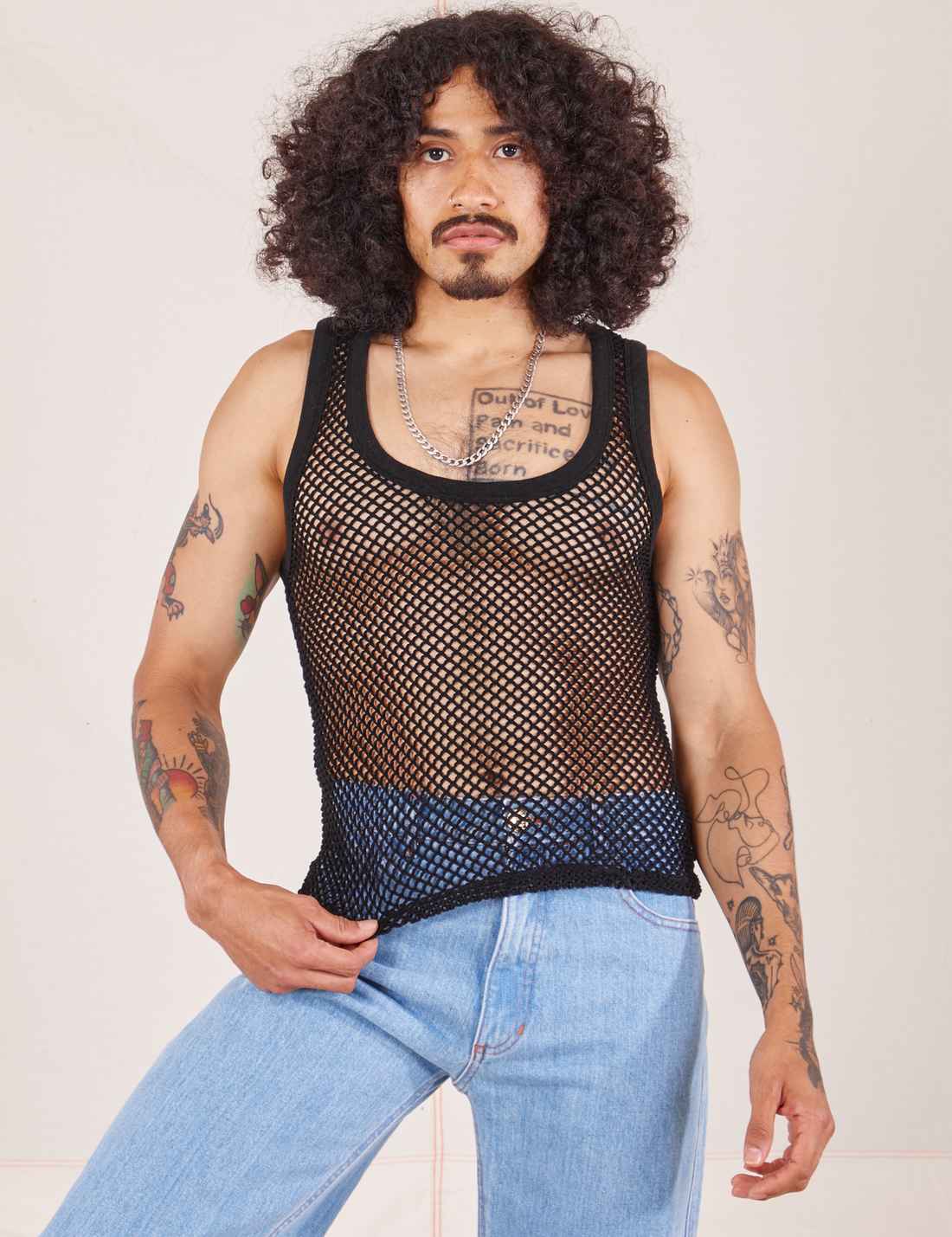Jesse is 5'8" and wearing XS Mesh Tank Top in Basic Black