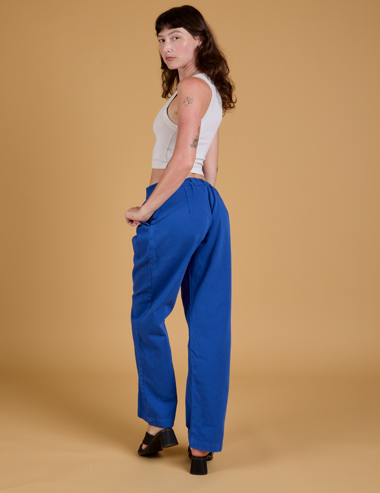 Baggy Mid-Rise Trousers in Royal Blue angled back view on Alex
