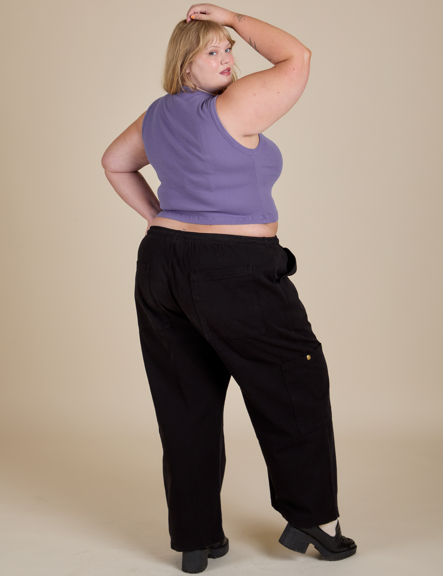 Back view of Muscle Tee in Faded Grape and black Drop Pocket Cargo Pants on Juliet