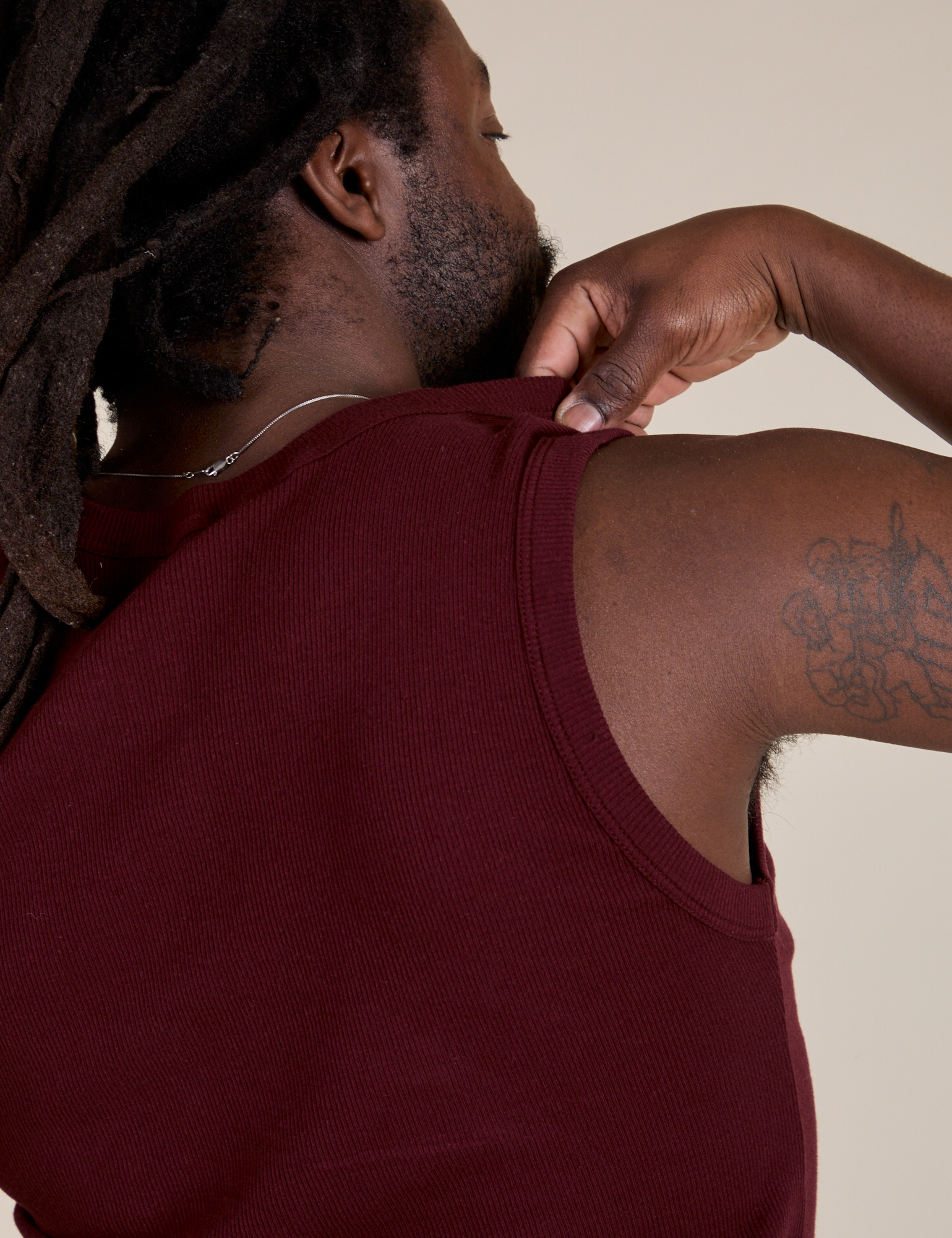 Back shoulder close up of  Muscle Tee in Red Wine on Demi