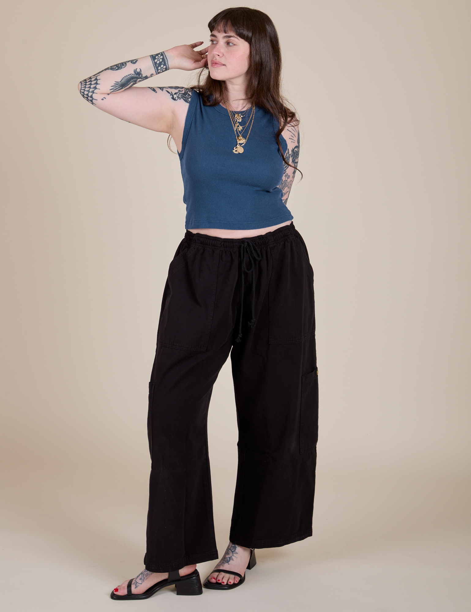 Sydney is wearing Muscle Tee in French Blue paired with black Drop Pocket Cargo Pants
