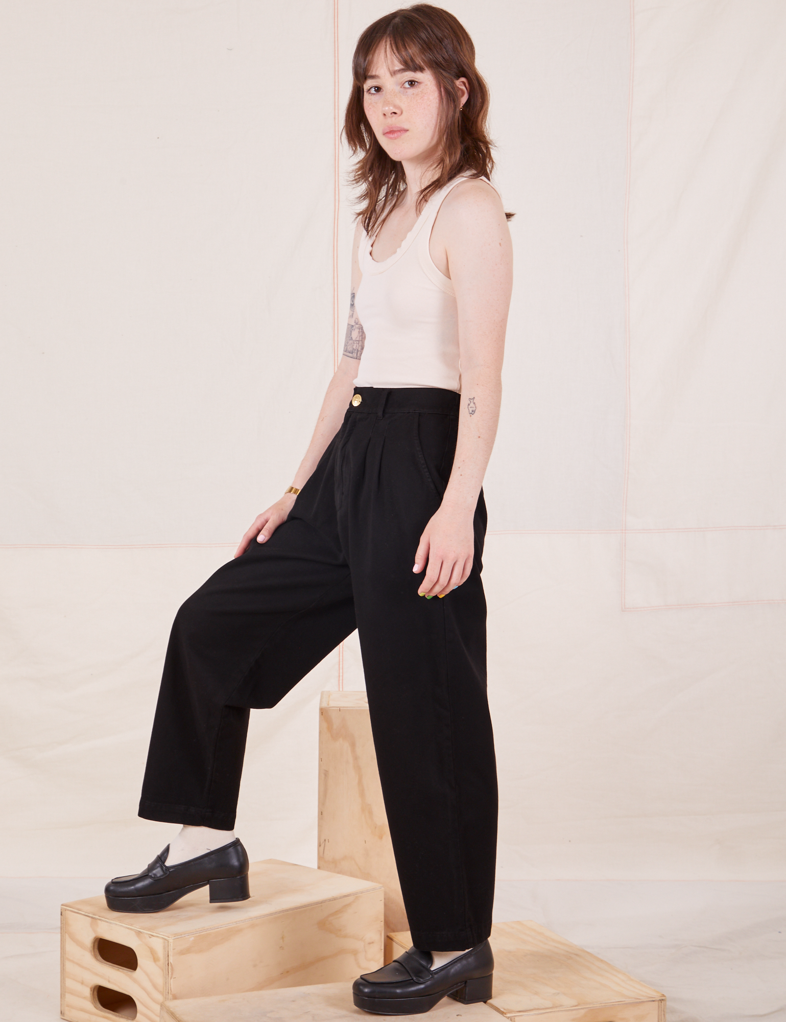 Side view of Organic Trousers in Basic Black worn by Hana