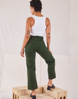 Back view of Organic Work Pants in Swamp Green and Racerback Tank in vintage tee off-white