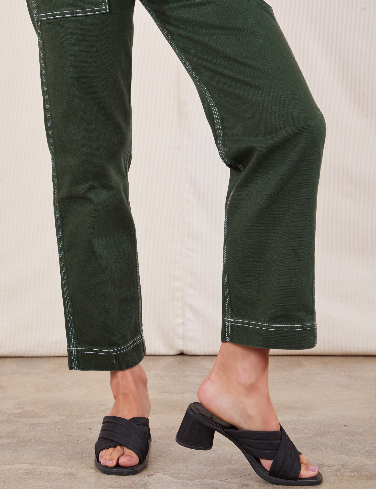 Original Overalls in Swamp Green pant leg close up on Alex