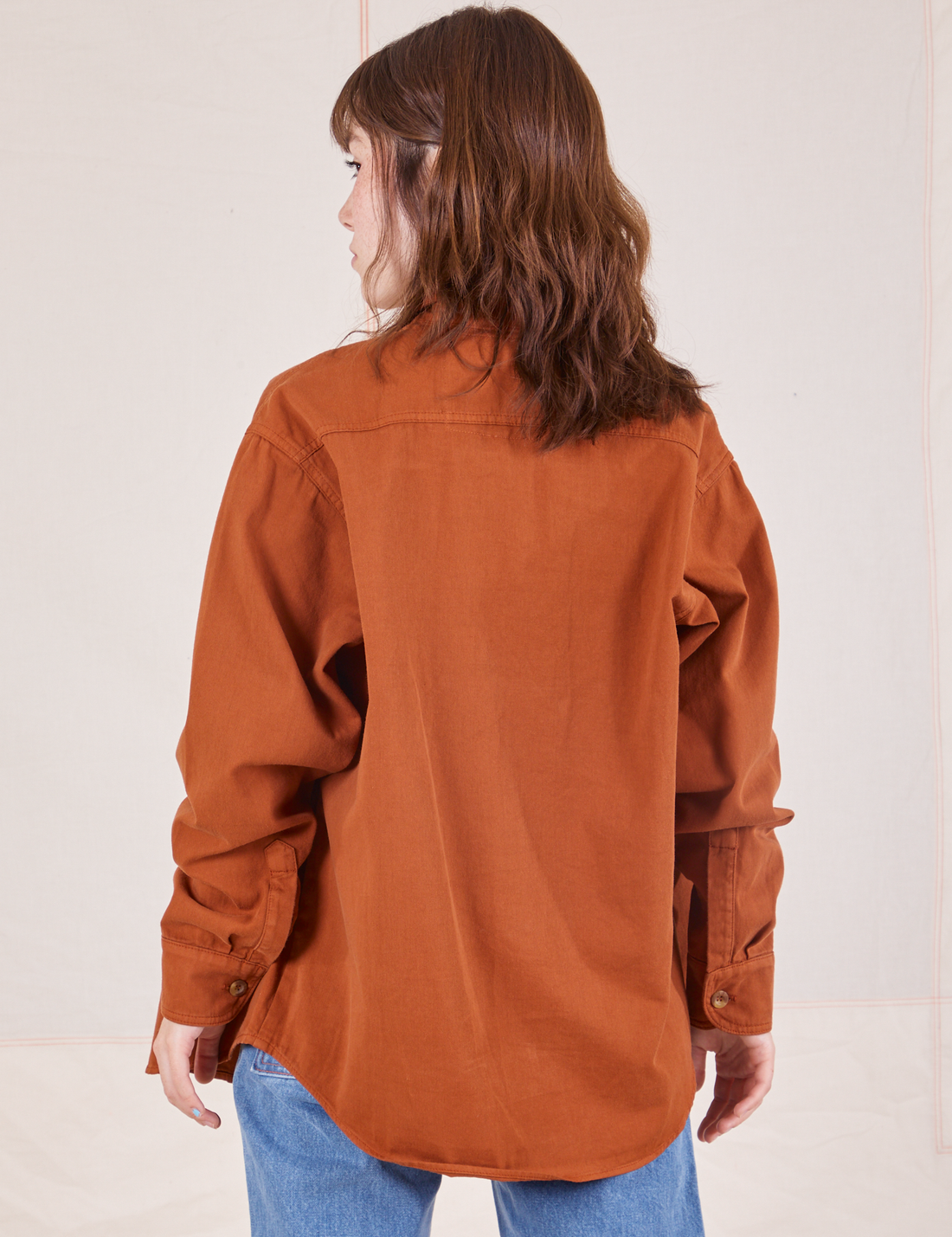 Back view of Oversize Overshirt in Burnt Terracotta worn by Hana