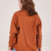 Back view of Oversize Overshirt in Burnt Terracotta worn by Hana