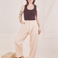Hana is 5'3" and wearing XXS Petite Heritage Trousers in Vintage Off-White paired with espresso brown Tank Top