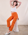 Work Pants in Construction Orange and Cropped Tank in Vintage Tee Off-White worn by Alex