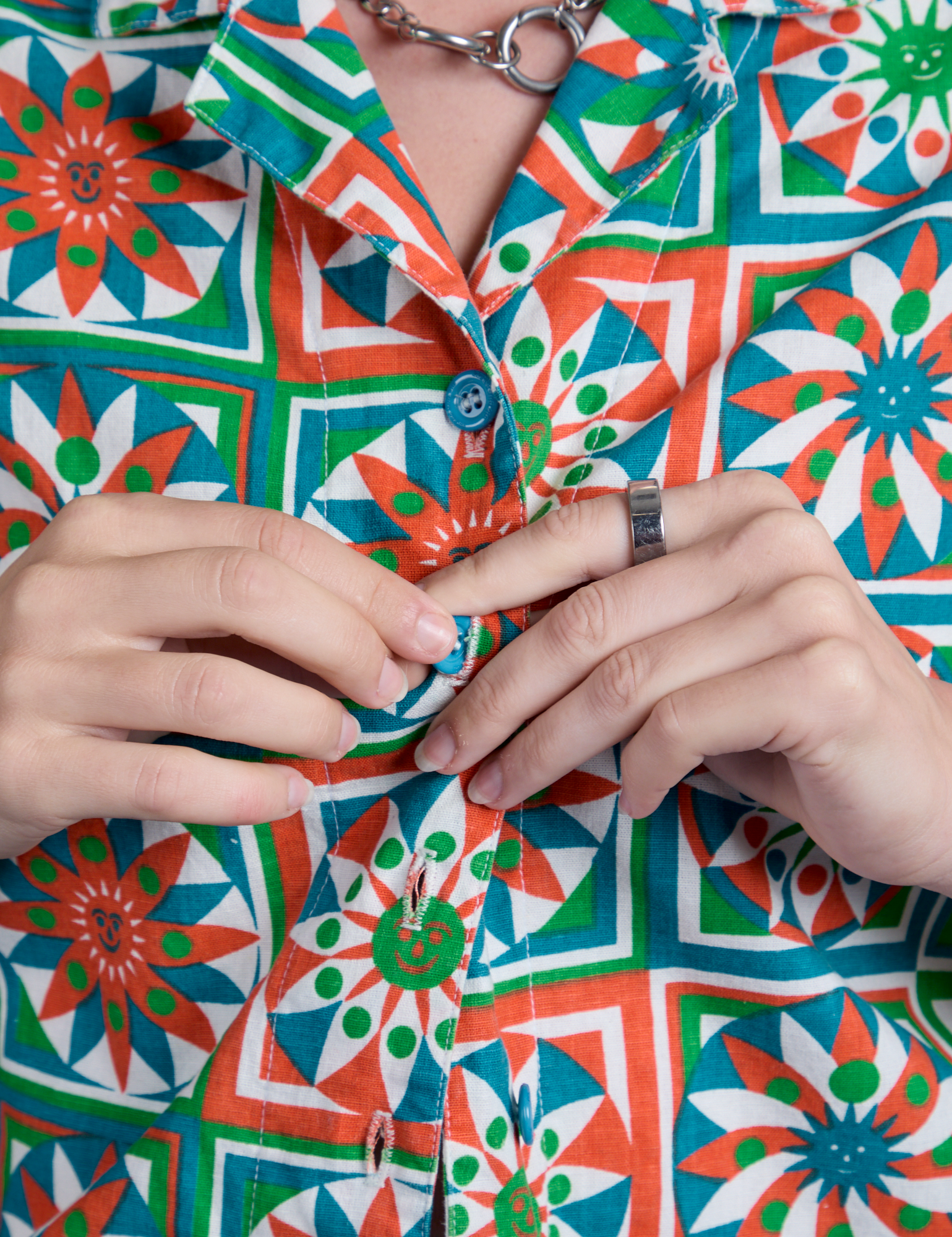 Close up of Alex buttoning up Quilt Print Pantry Button-Up 