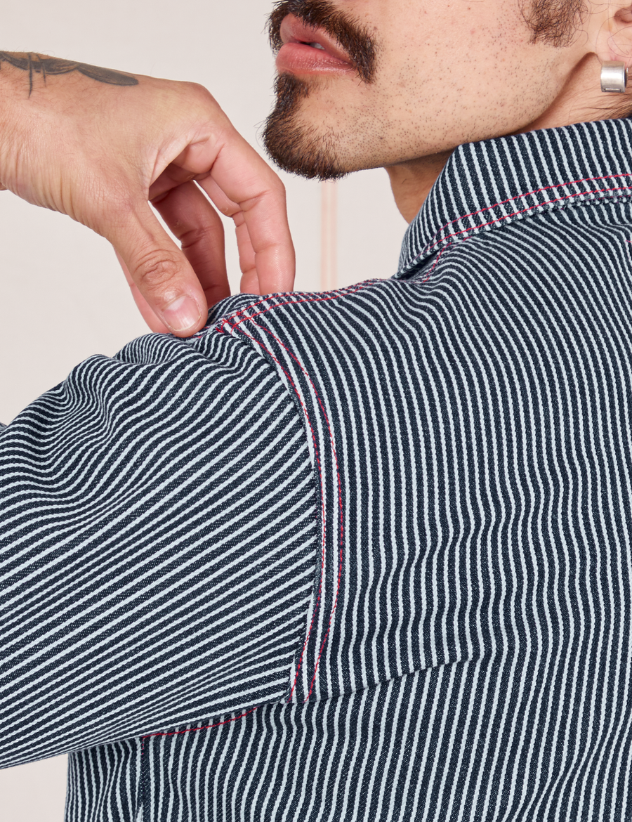 Back shoulder close up of Railroad Stripe Denim Work Jacket worn by Jesse