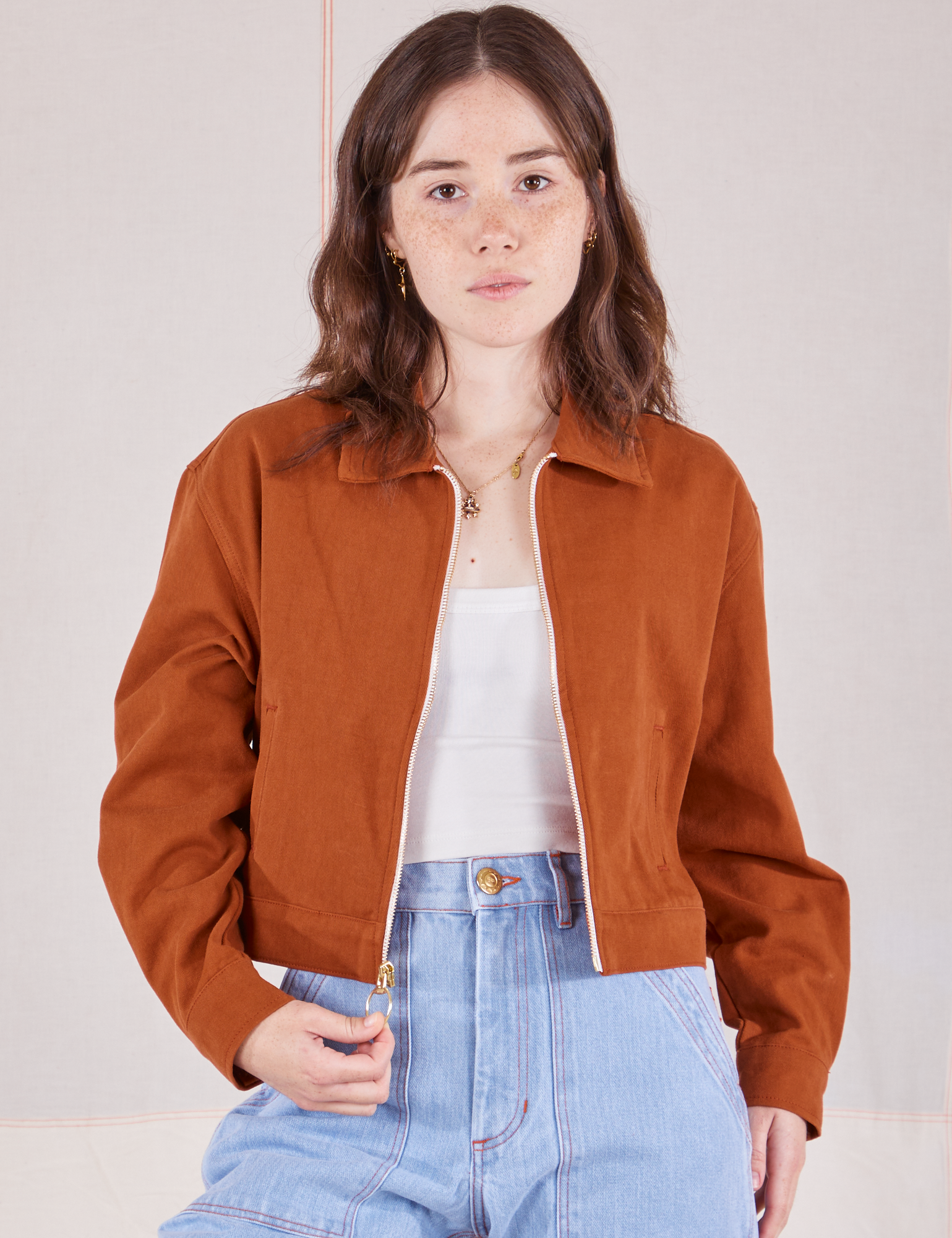 Hana is 5’3” and wearing P Ricky Jacket in Burnt Terracotta