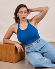 Tiara is wearing Halter Top in Royal Blue and light wash Carpenter Jeans