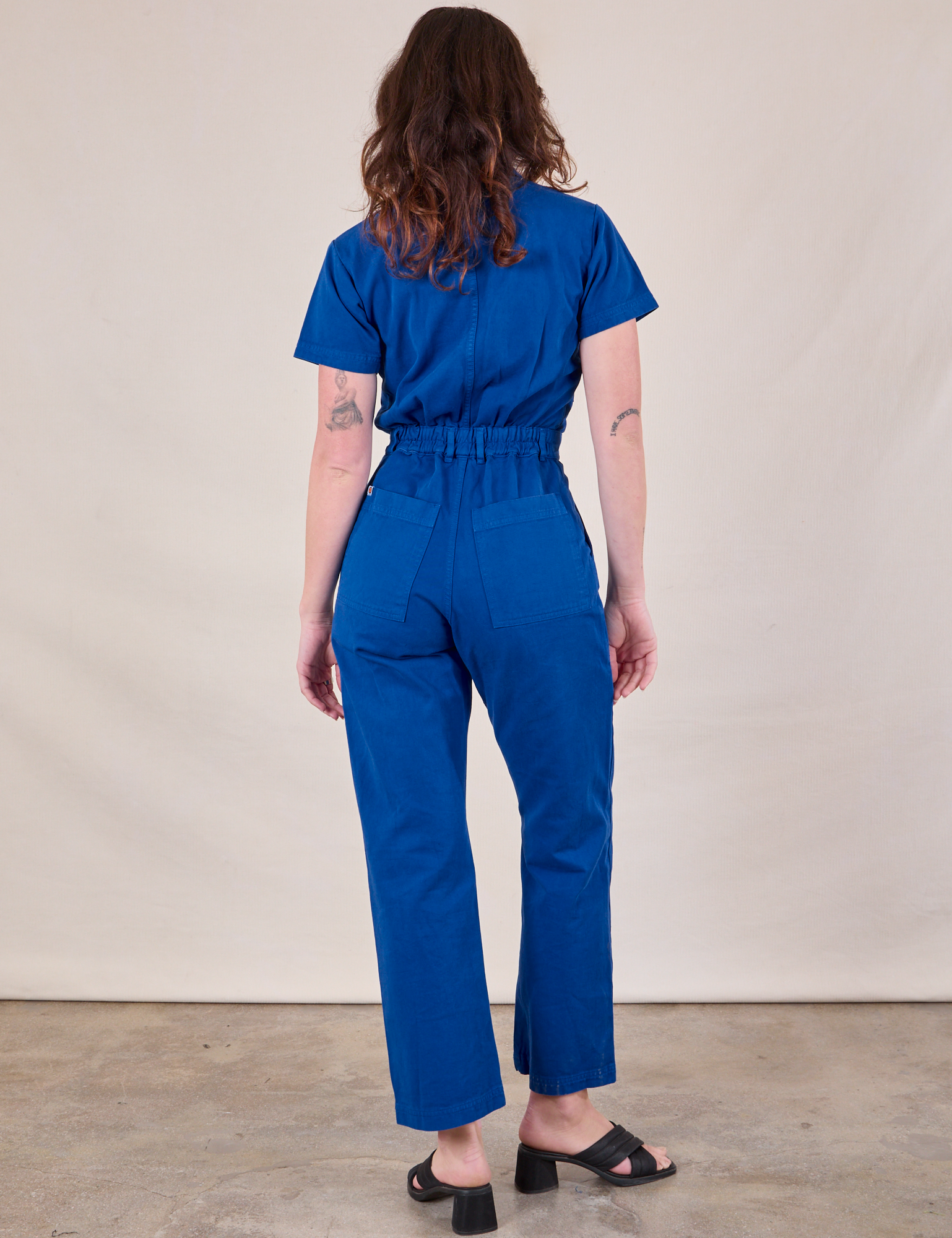 Short Sleeve Jumpsuit in Royal Blue back view on Alex