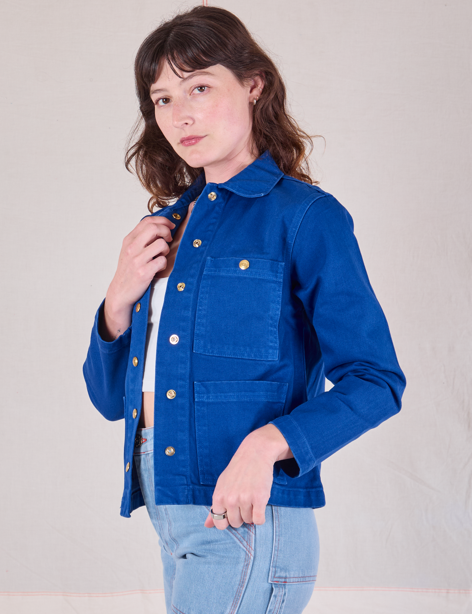 Angled front view of. Denim Work Jacket in Royal Blue on Alex