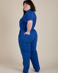 Angled back view of Short Sleeve Jumpsuit in Royal Blue on Ashley