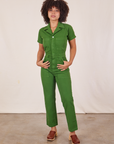 Gabi is 5’7” and wearing XS Short Sleeve Jumpsuit in Lawn Green