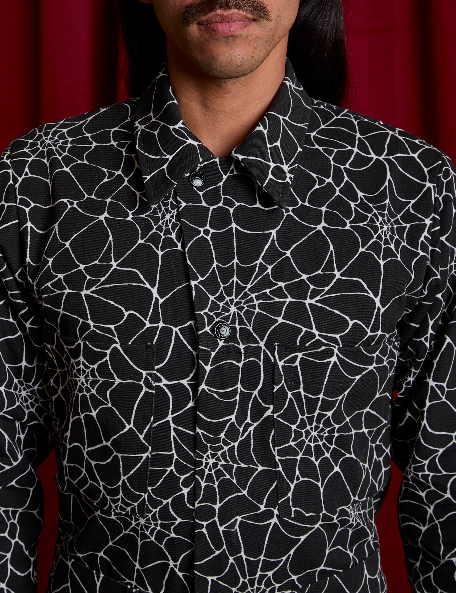 Everyday Jumpsuit in Spiderwebs buttoned up front close up on Anthony