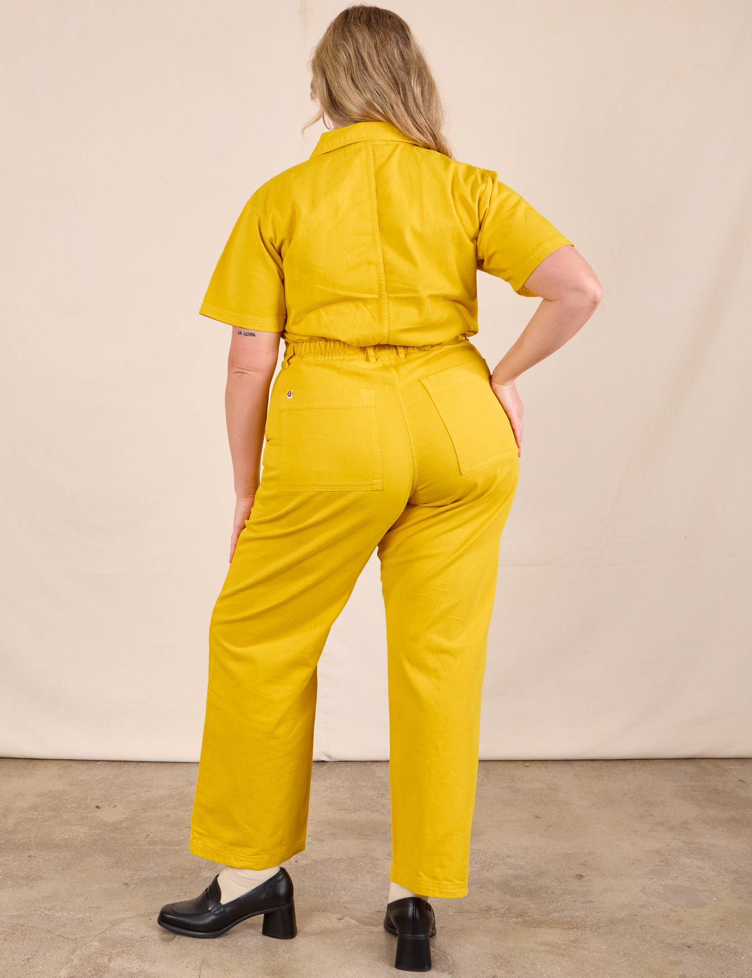 Short Sleeve Jumpsuit in Golden Yellow back view on Lish