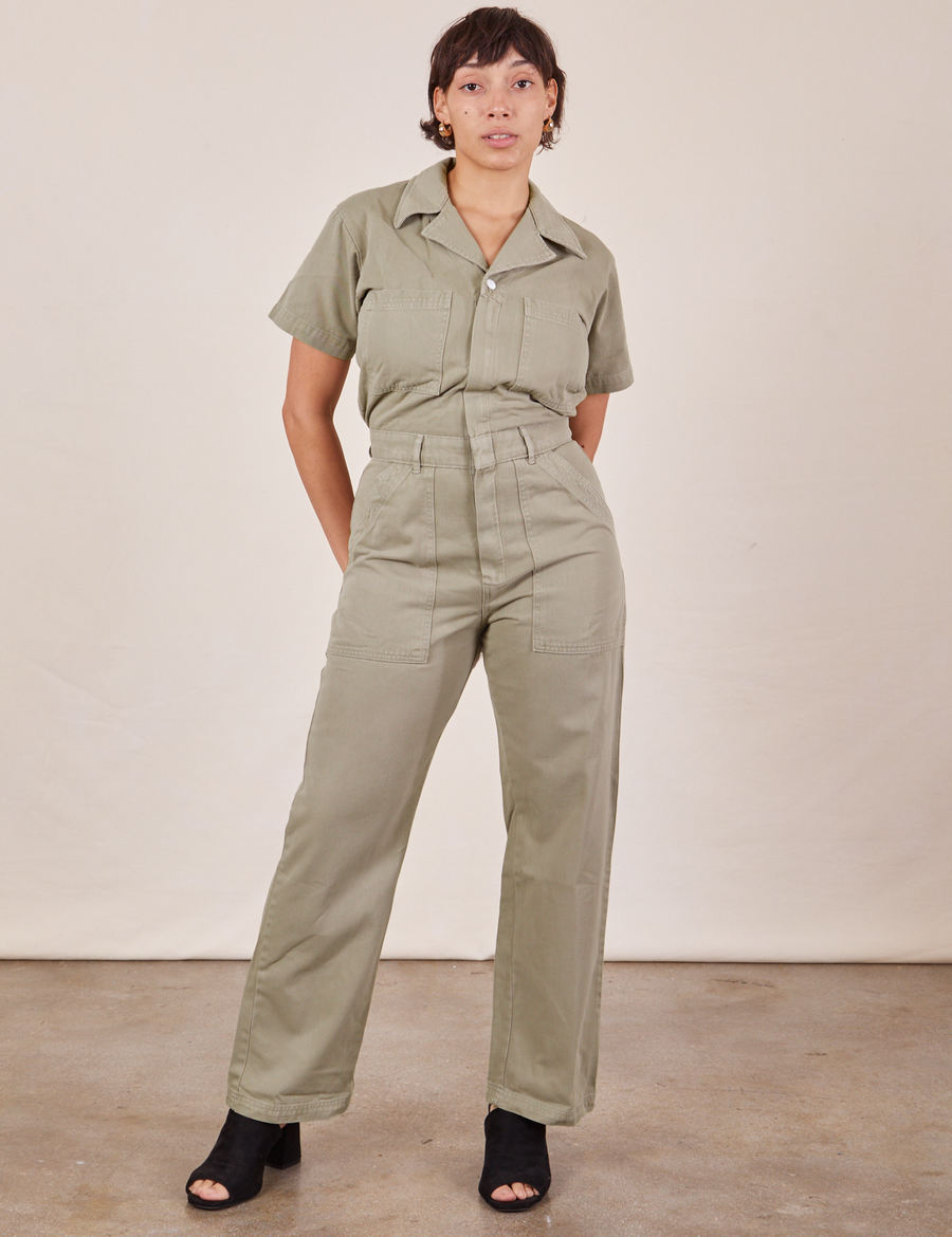 Tiara is 5'4" and wearing S Short Sleeve Jumpsuit in Khaki Grey