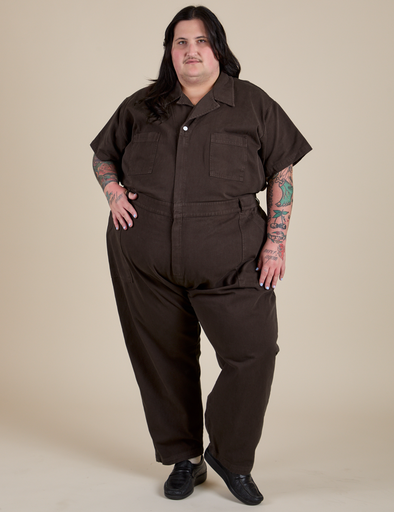 Sam is 5'10" and wearing 4XL Short Sleeve Jumpsuit in Espresso Brown